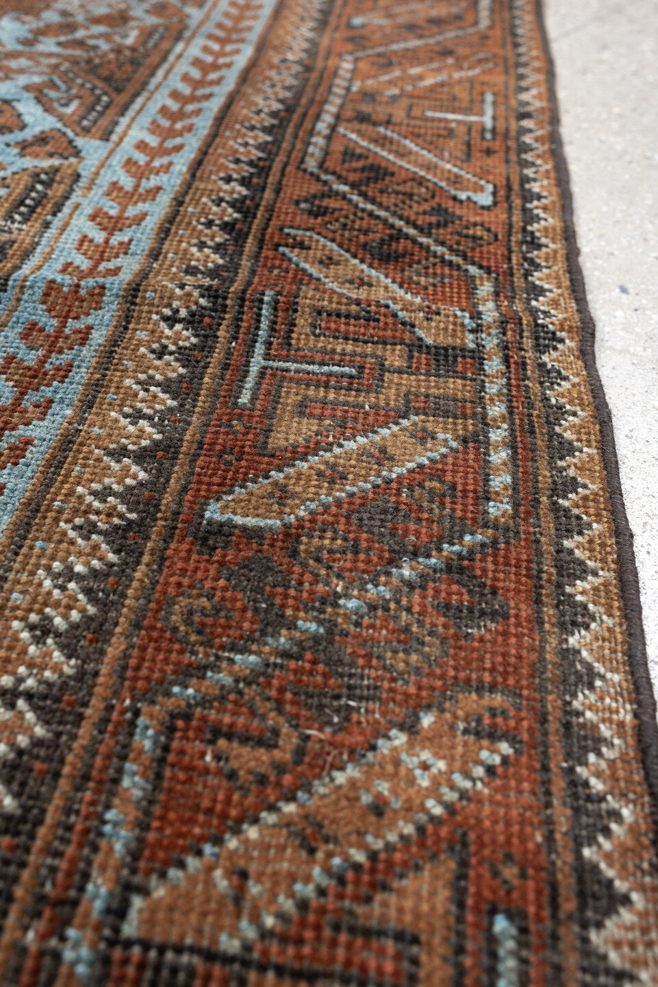 2' x 4' one-of-a-kind handmade antique Belouch small size rug. Color palette: rust, pale blue, camel, dark brown, ivory