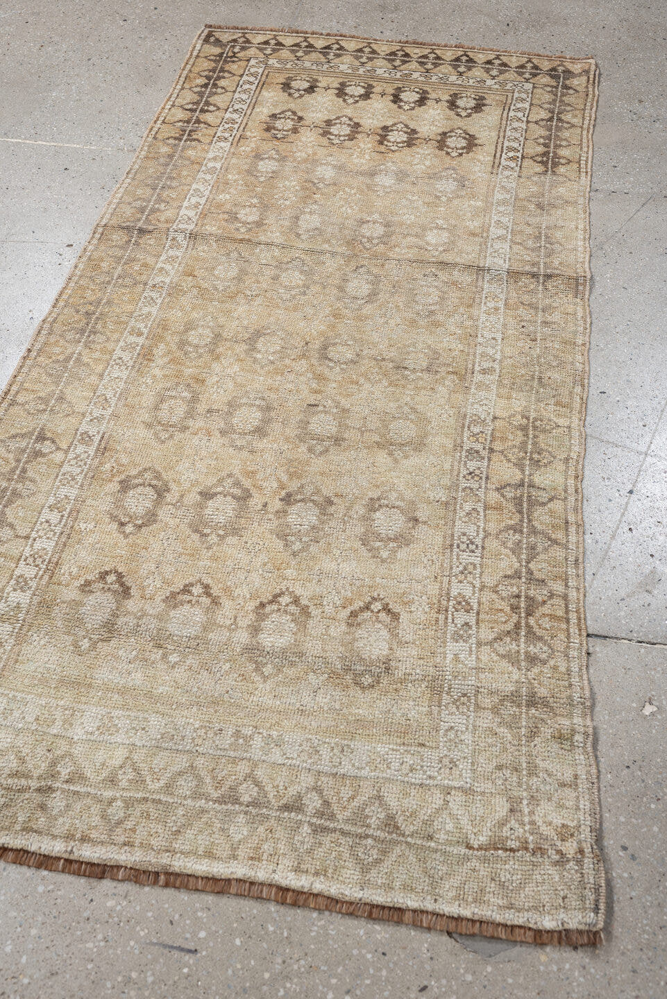 2' x 6' one-of-a-kind handmade antique Caucasian runner rug. Color palette: ivory, beige, taupe, brown, camel, gray
