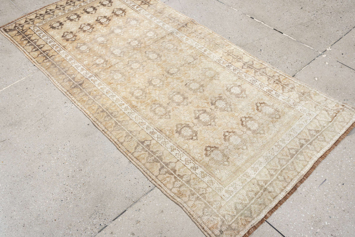 2' x 6' one-of-a-kind handmade antique Caucasian runner rug. Color palette: ivory, beige, taupe, brown, camel, gray