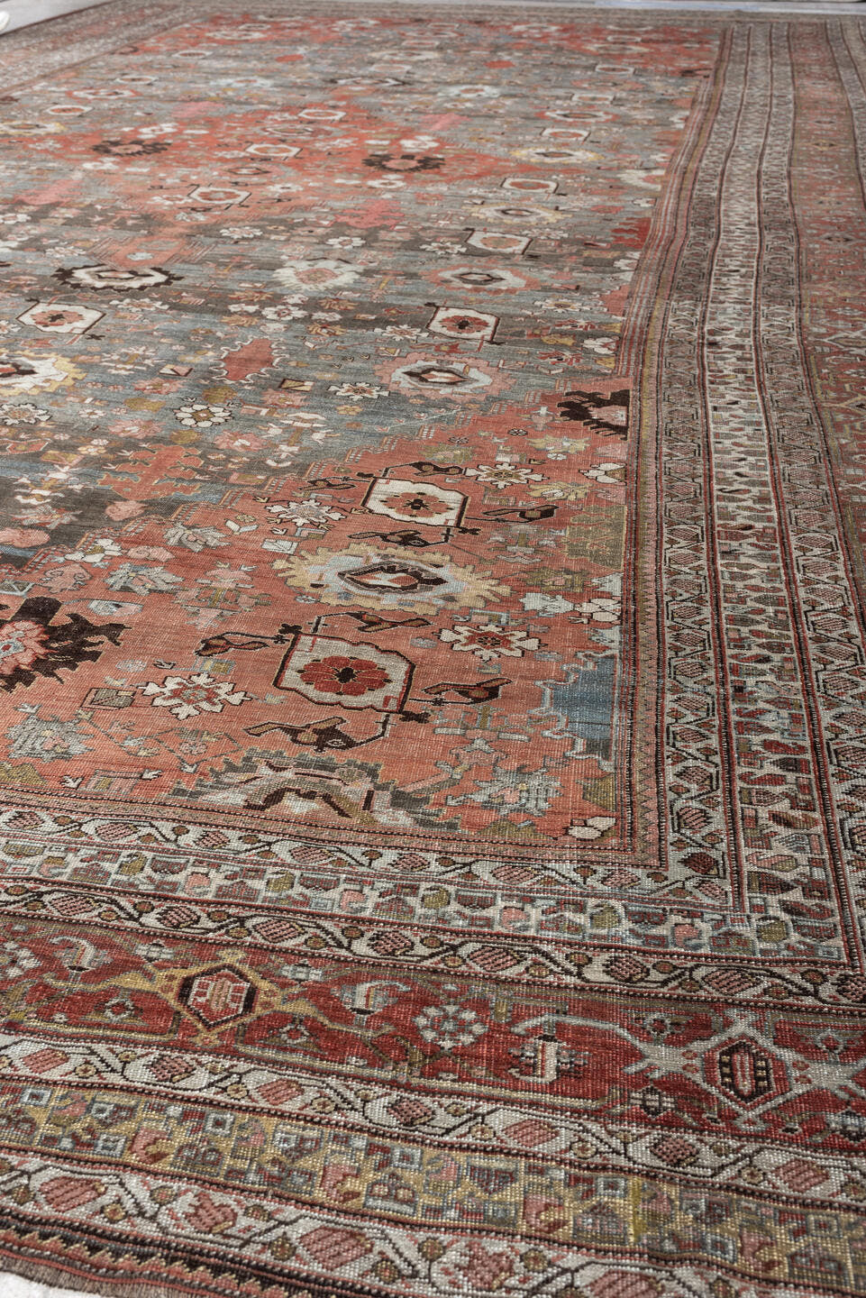 12' x 22' one-of-a-kind handmade antique Bidjar oversize rug. Color palette: terracotta, blue gray, ivory, rust, coral