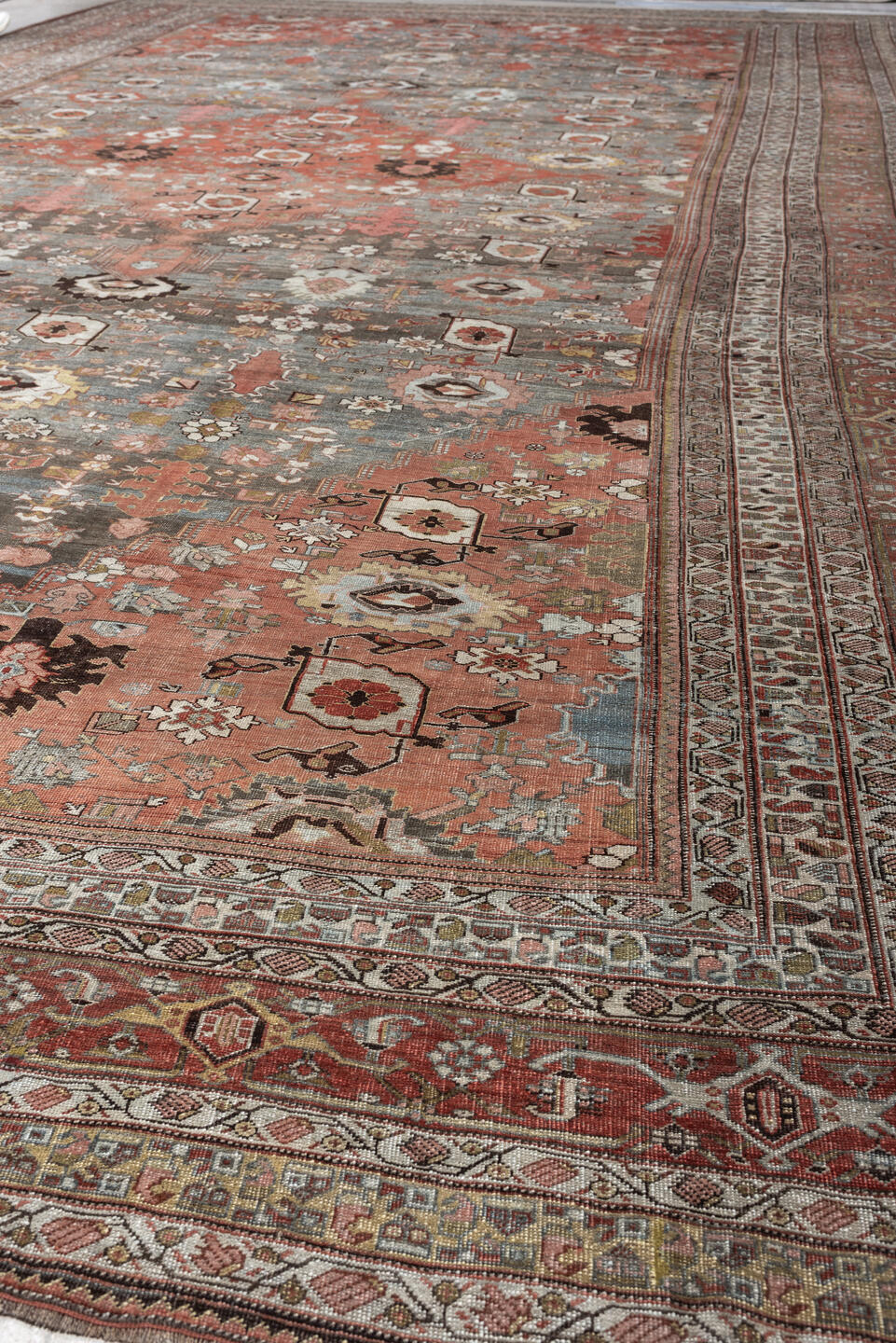 12' x 22' one-of-a-kind handmade antique Bidjar oversize rug. Color palette: terracotta, blue gray, ivory, rust, coral