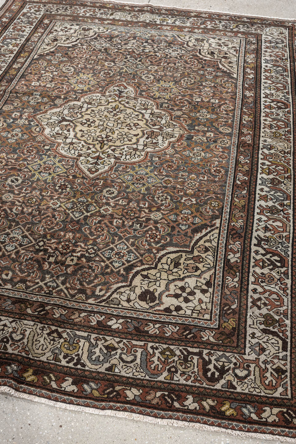 5' x 6' one-of-a-kind handmade antique Malayer rug. Color palette: ivory, rust, dark brown, indigo, slate blue, taupe, olive