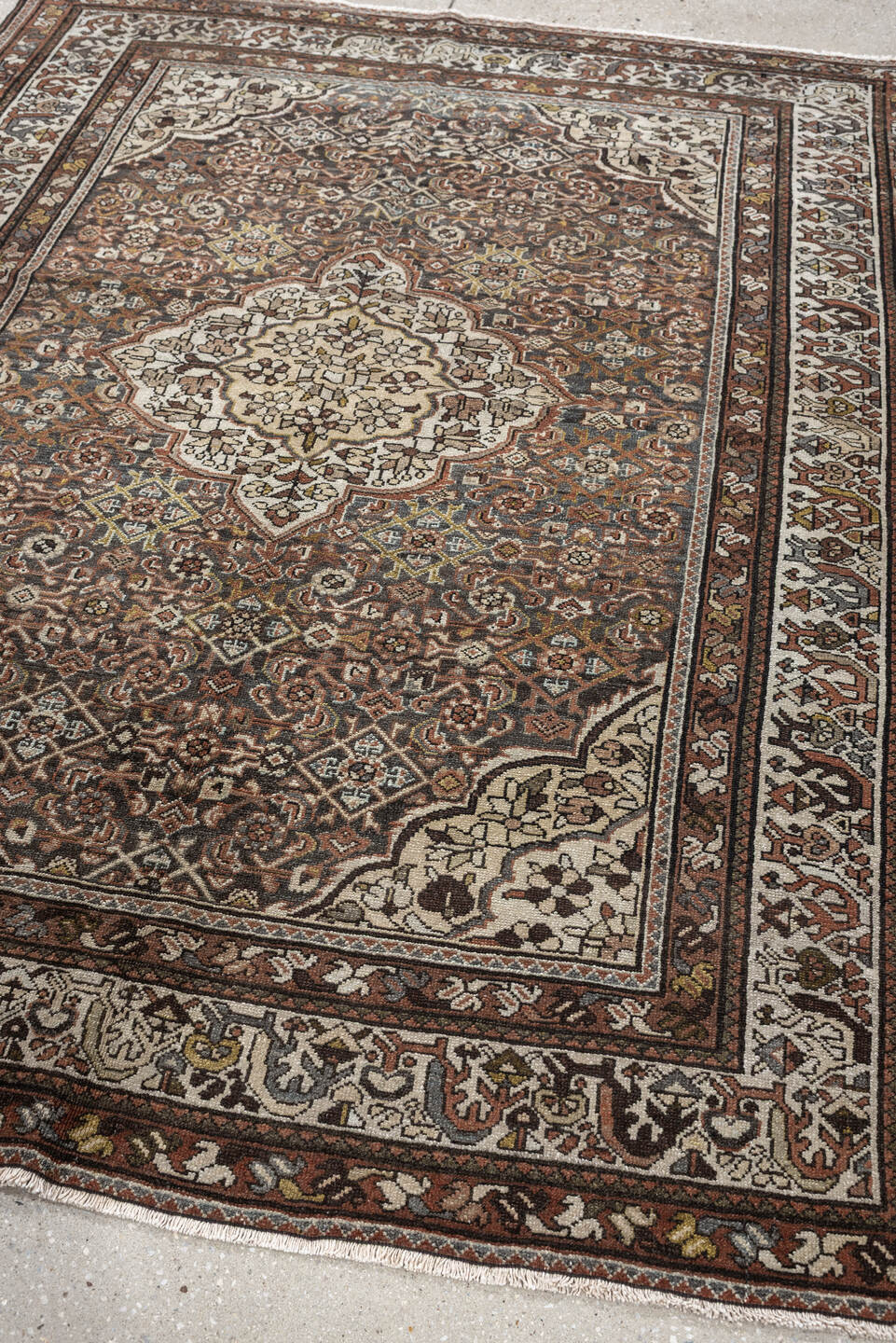 5' x 6' one-of-a-kind handmade antique Malayer rug. Color palette: ivory, rust, dark brown, indigo, slate blue, taupe, olive