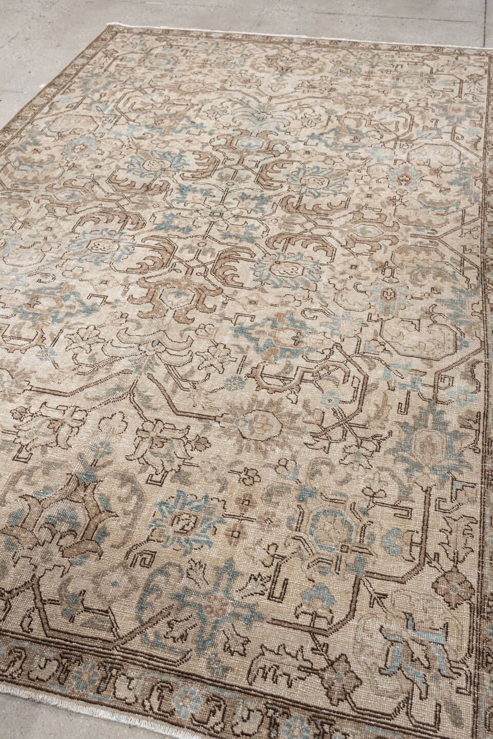 5' x 8' one-of-a-kind handmade antique Tabriz medium size rug. Color palette: ivory, taupe, pale blue, camel, light brown