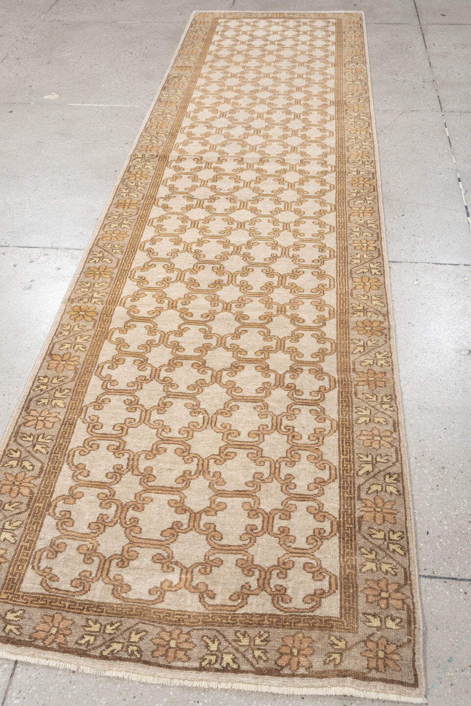 2' x 10' one-of-a-kind handmade antique Khotan runner rug. Color palette: ivory, taupe, beige, pale peach, camel, gray