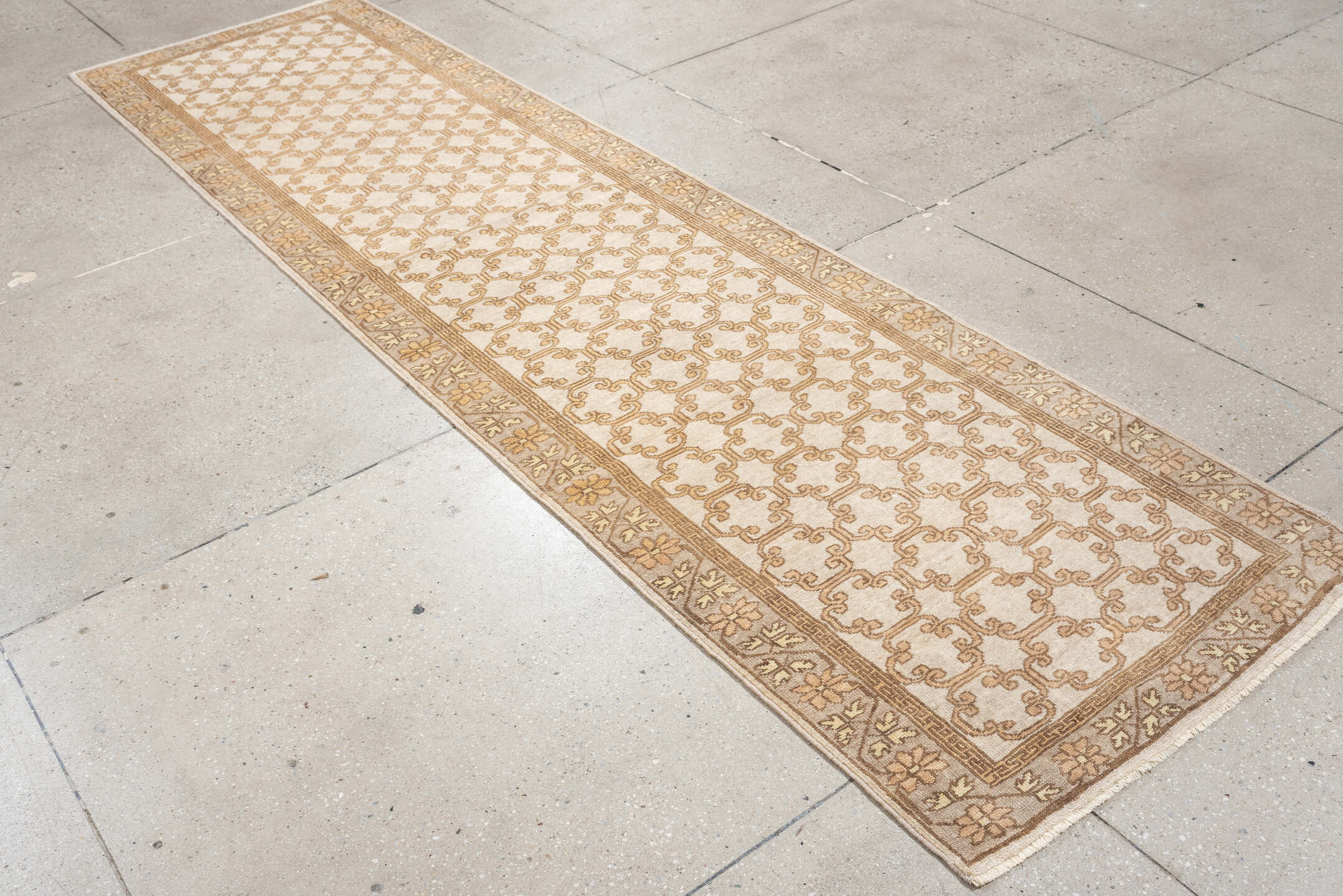 2' x 10' one-of-a-kind handmade antique Khotan runner rug. Color palette: ivory, taupe, beige, pale peach, camel, gray