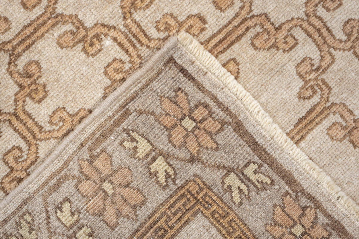 2' x 10' one-of-a-kind handmade antique Khotan runner rug. Color palette: ivory, taupe, beige, pale peach, camel, gray