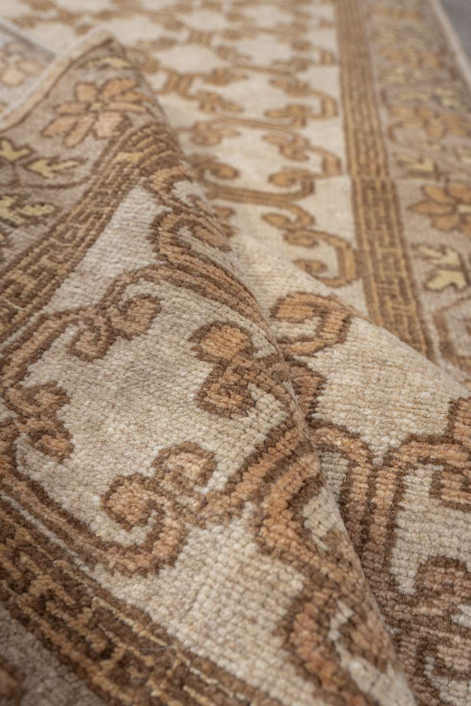 2' x 10' one-of-a-kind handmade antique Khotan runner rug. Color palette: ivory, taupe, beige, pale peach, camel, gray