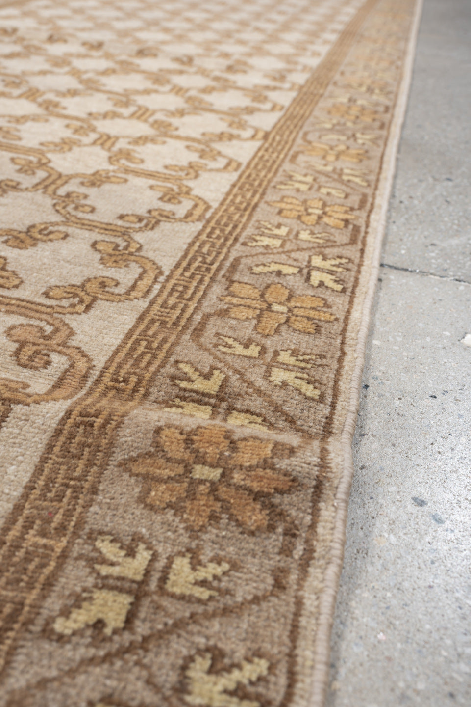 2' x 10' one-of-a-kind handmade antique Khotan runner rug. Color palette: ivory, taupe, beige, pale peach, camel, gray