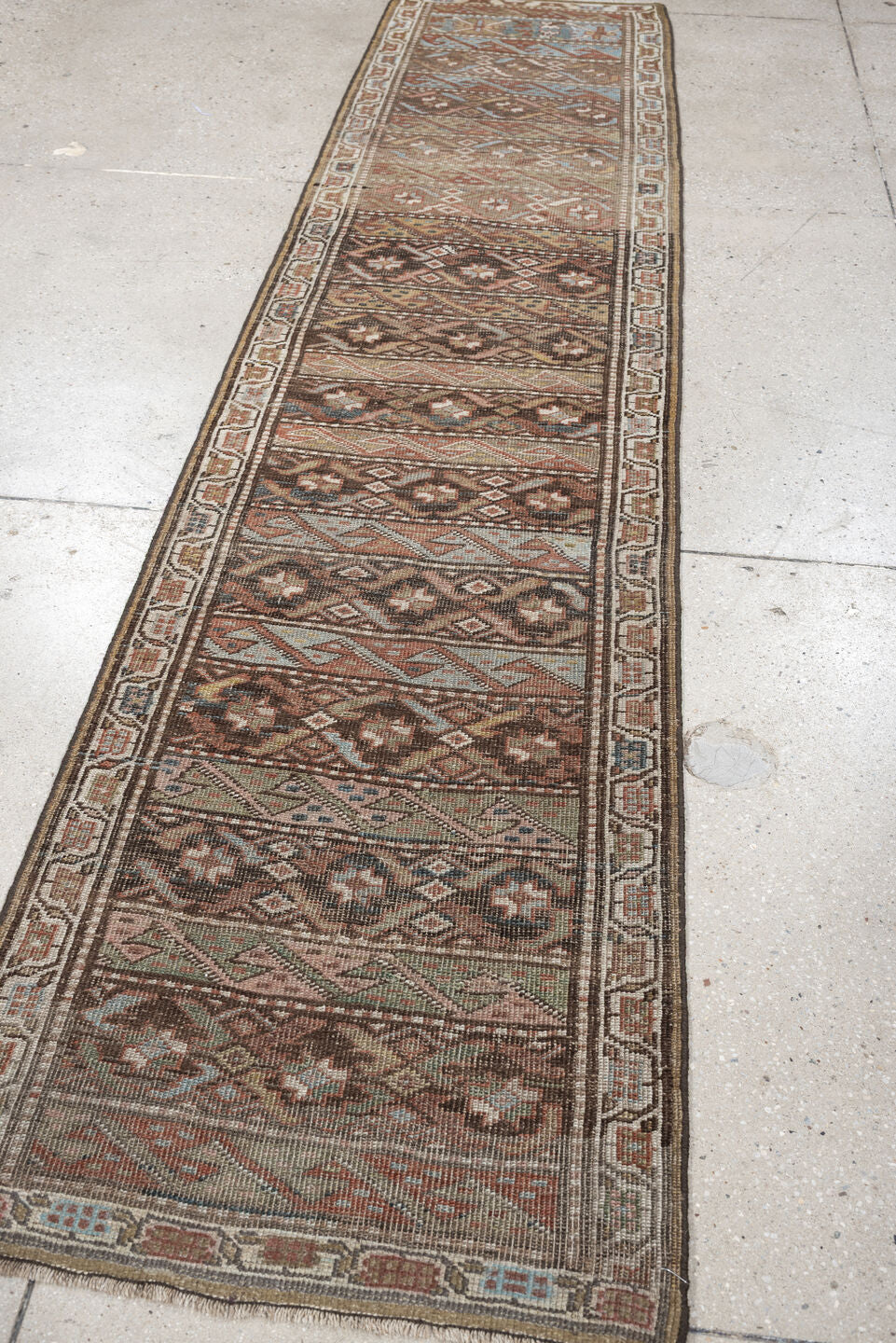 2' x 9' one-of-a-kind handmade antique Bidjar runner rug. Color palette: brown, ivory, rust, sky blue, taupe, camel