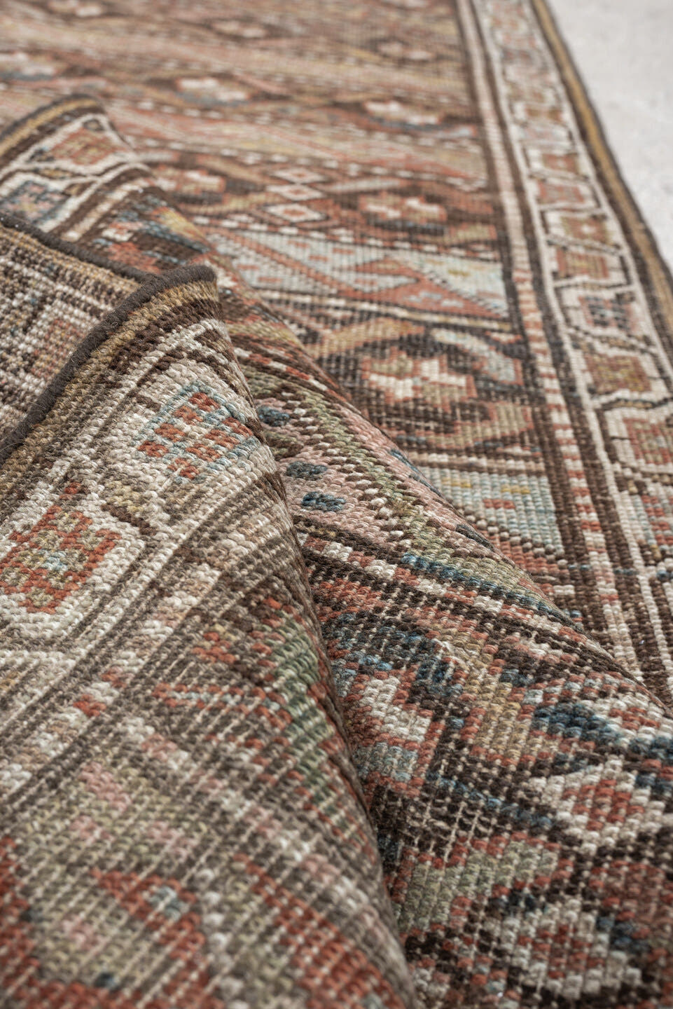 2' x 9' one-of-a-kind handmade antique Bidjar runner rug. Color palette: brown, ivory, rust, sky blue, taupe, camel