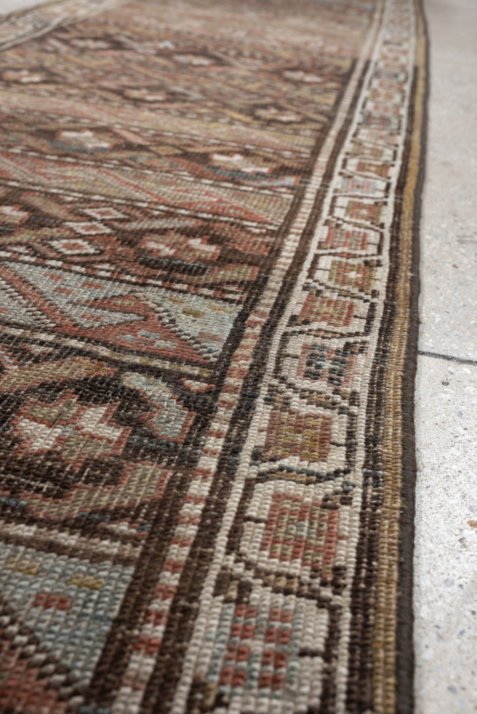 2' x 9' one-of-a-kind handmade antique Bidjar runner rug. Color palette: brown, ivory, rust, sky blue, taupe, camel
