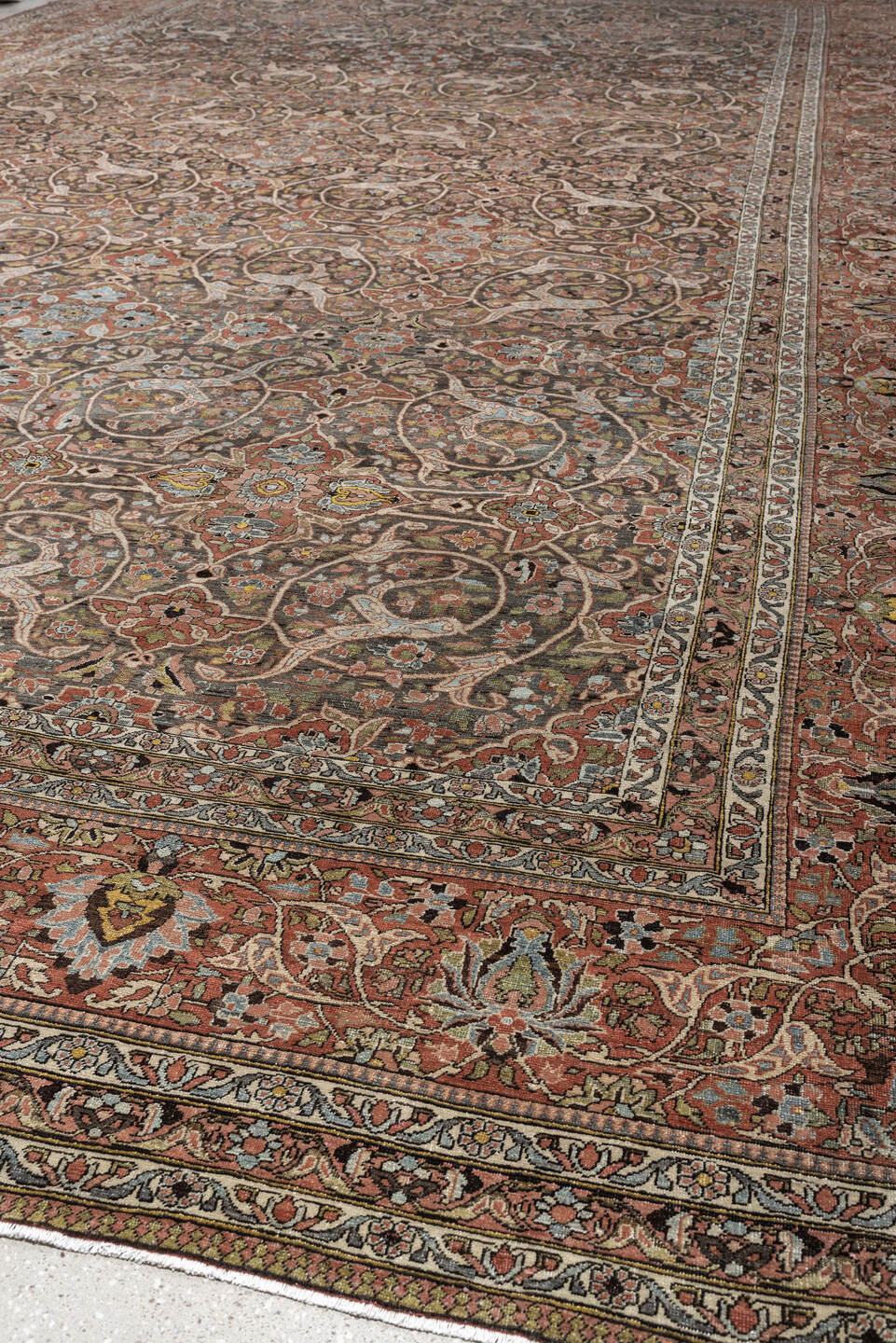 22' x 13' one-of-a-kind handmade antique Baktiary oversize rug. Color palette: charcoal, terracotta, ivory, teal, sage, gold