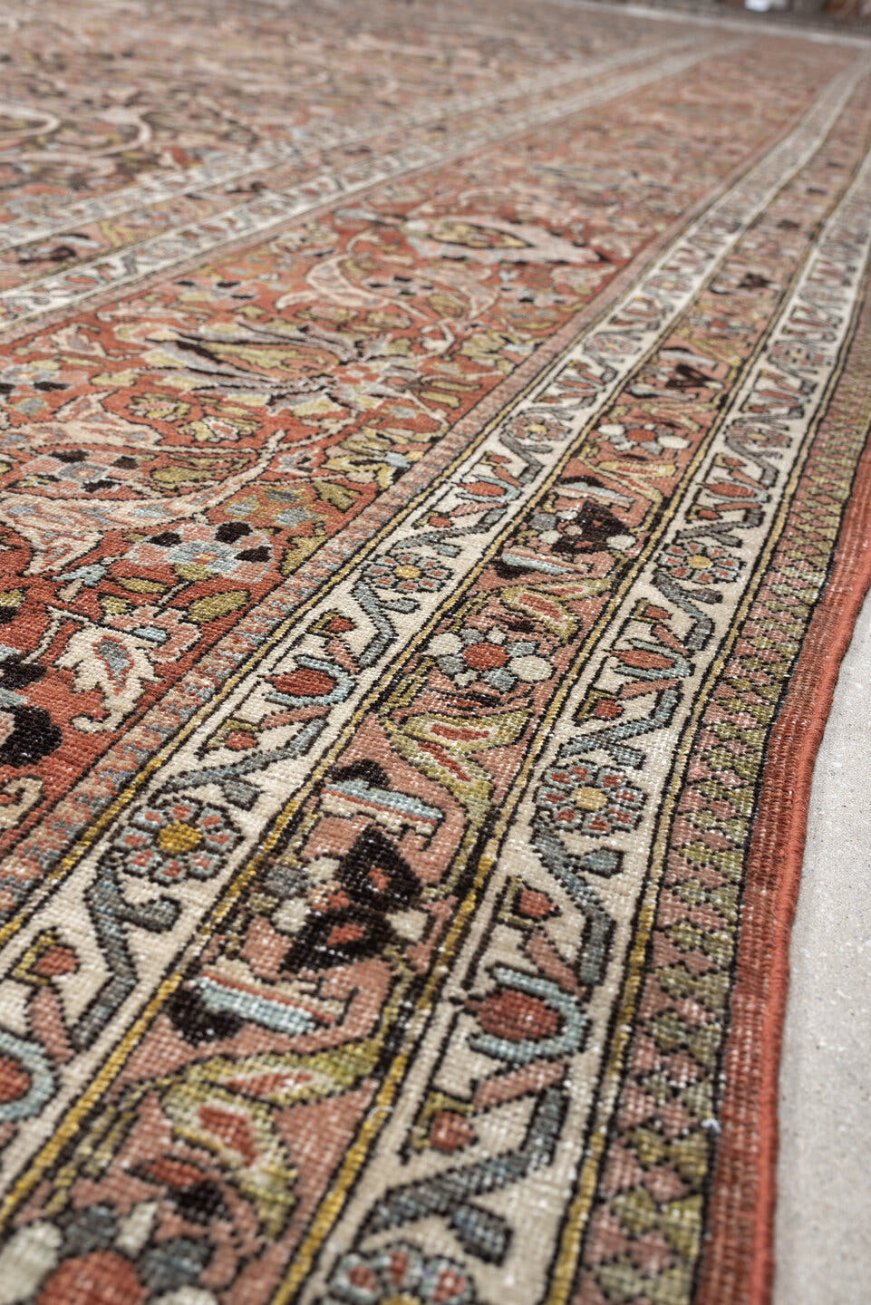 22' x 13' one-of-a-kind handmade antique Baktiary oversize rug. Color palette: charcoal, terracotta, ivory, teal, sage, gold