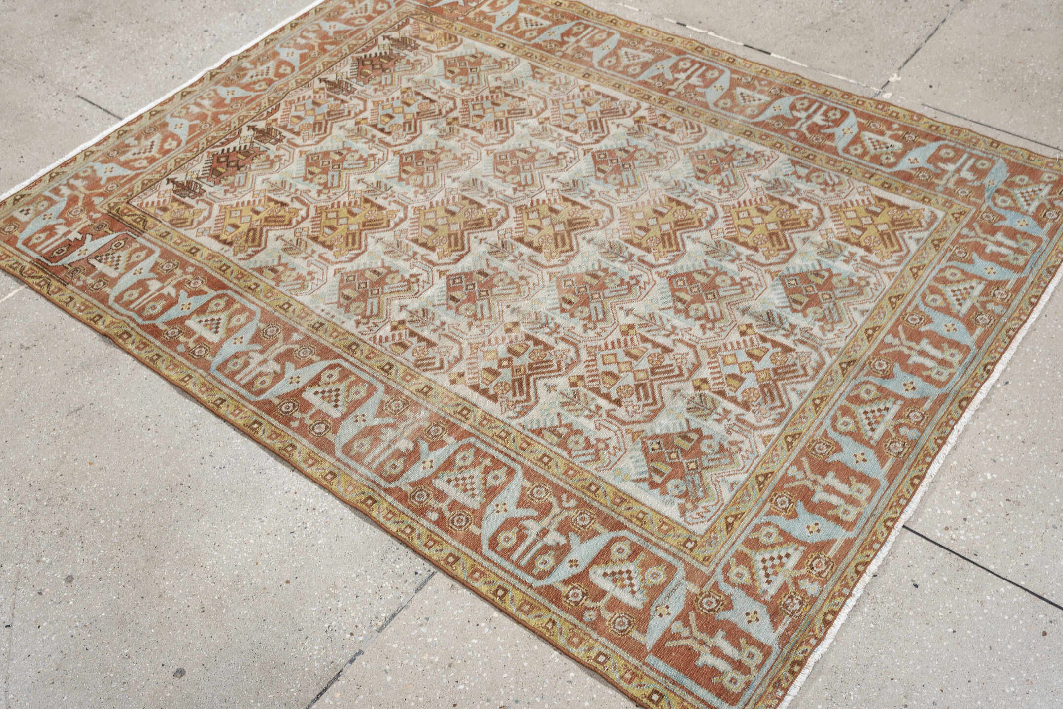 4' x 5' one-of-a-kind handmade antique Afshar small size rug. Color palette: ivory, terra cotta, pale blue, camel, taupe