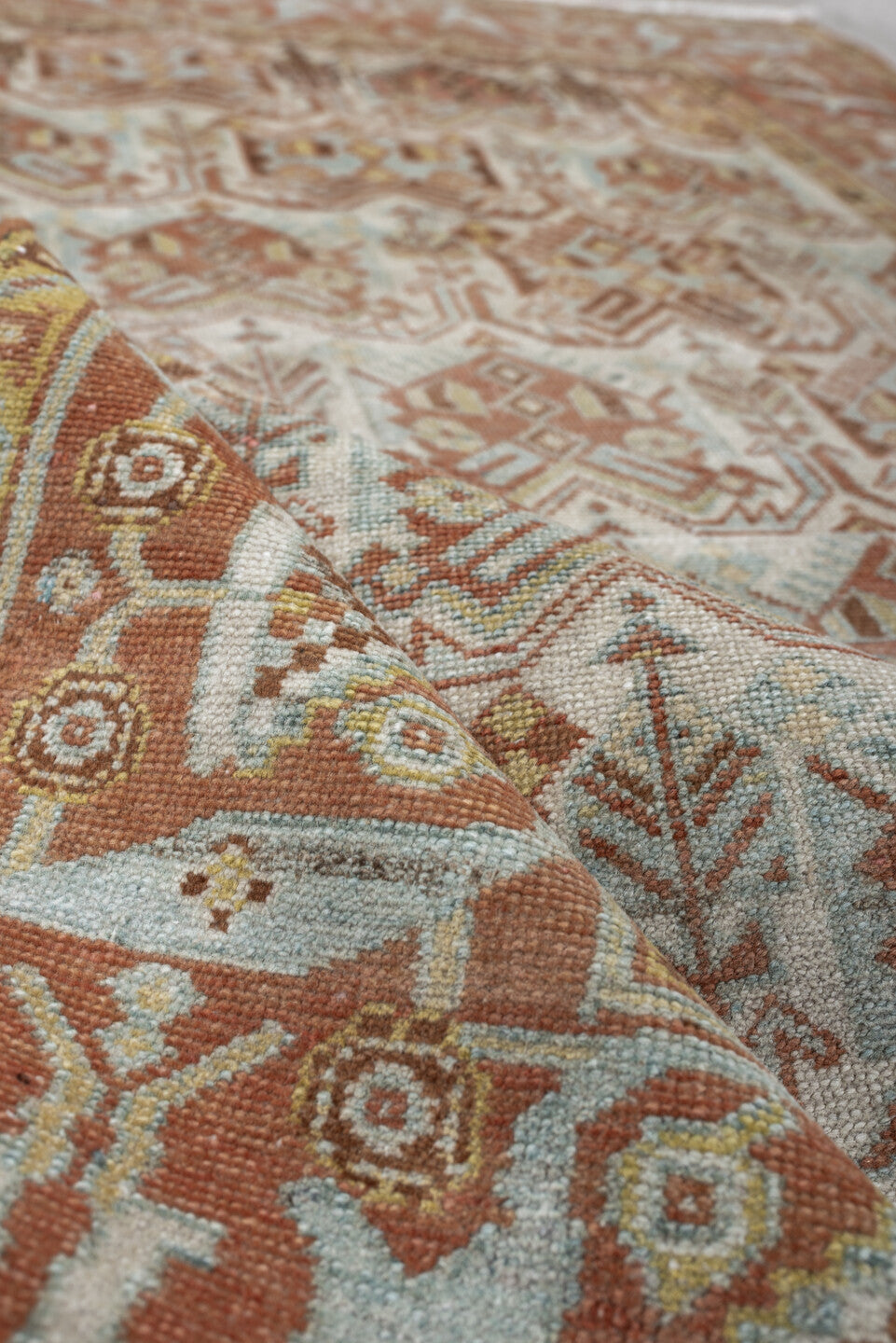 4' x 5' one-of-a-kind handmade antique Afshar small size rug. Color palette: ivory, terra cotta, pale blue, camel, taupe