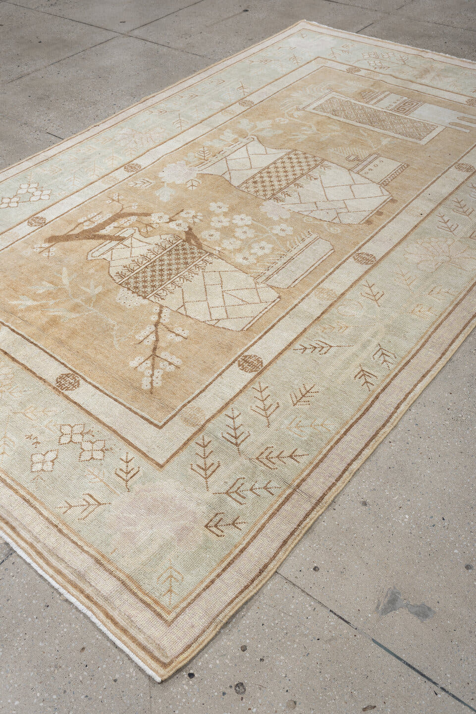 5' x 9' one-of-a-kind handmade antique Khotan medium size rug. Color palette: ivory, sand, celadon, beige, taupe, camel