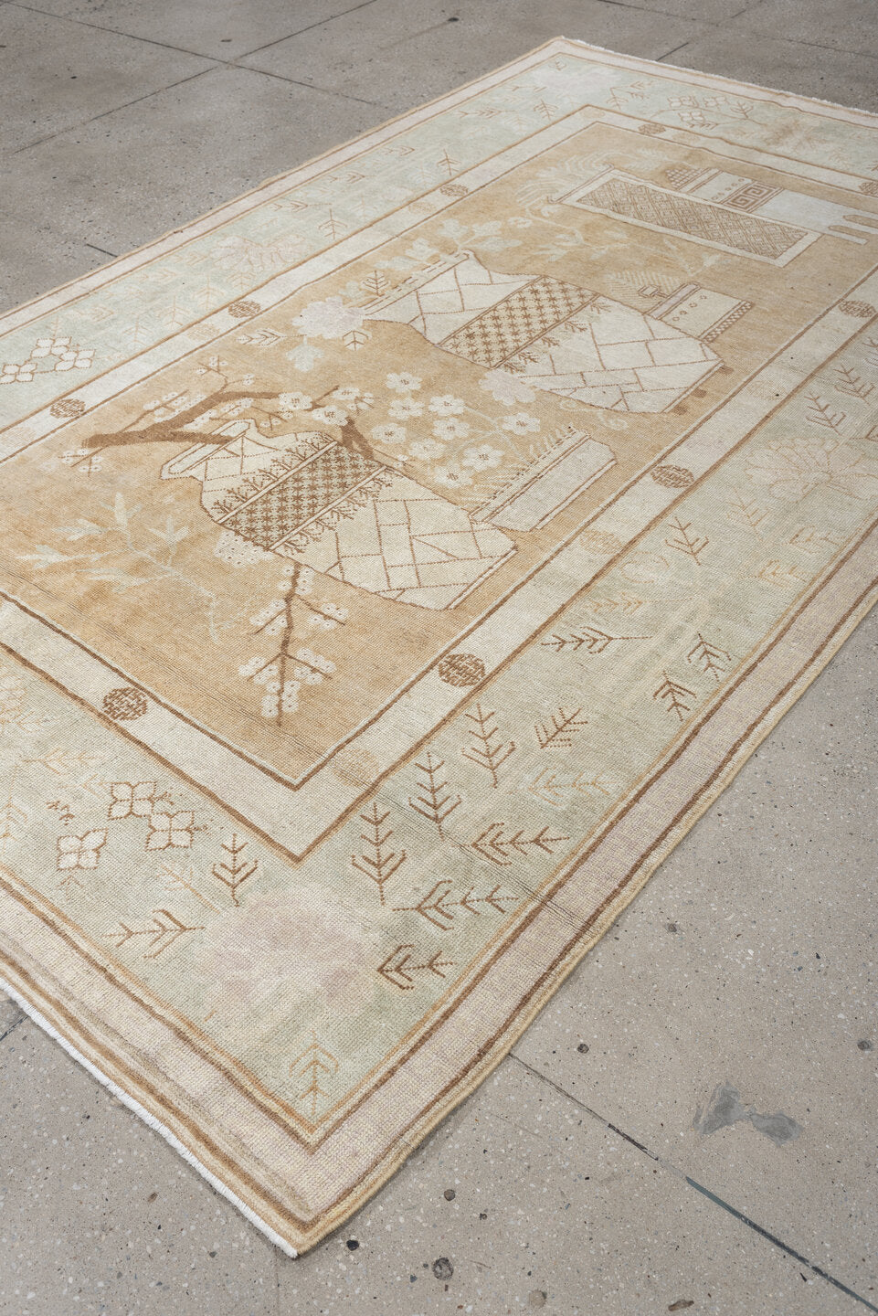 5' x 9' one-of-a-kind handmade antique Khotan medium size rug. Color palette: ivory, sand, celadon, beige, taupe, camel