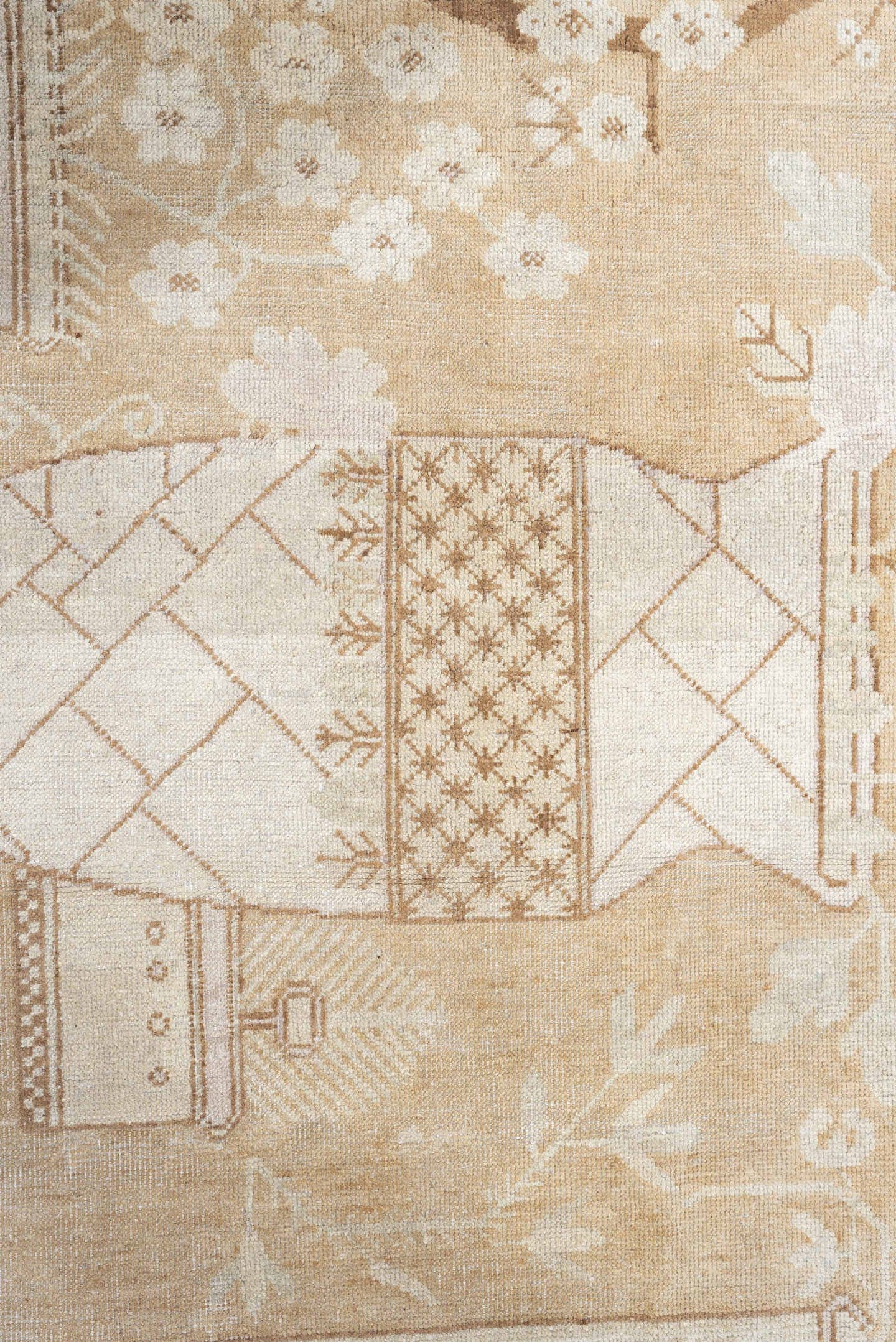 5' x 9' one-of-a-kind handmade antique Khotan medium size rug. Color palette: ivory, sand, celadon, beige, taupe, camel