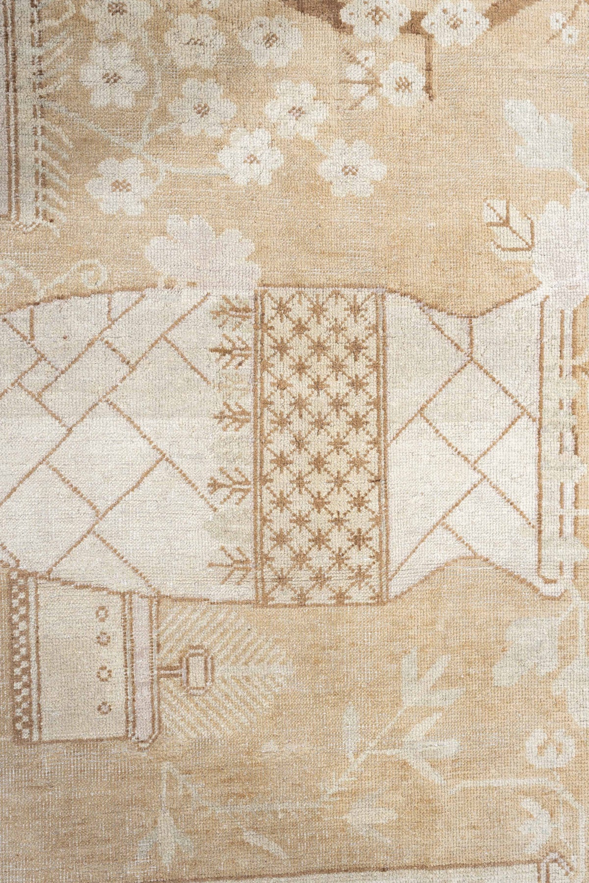 5' x 9' one-of-a-kind handmade antique Khotan medium size rug. Color palette: ivory, sand, celadon, beige, taupe, camel
