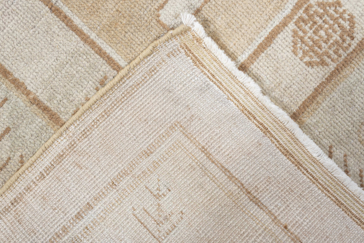 5' x 9' one-of-a-kind handmade antique Khotan medium size rug. Color palette: ivory, sand, celadon, beige, taupe, camel