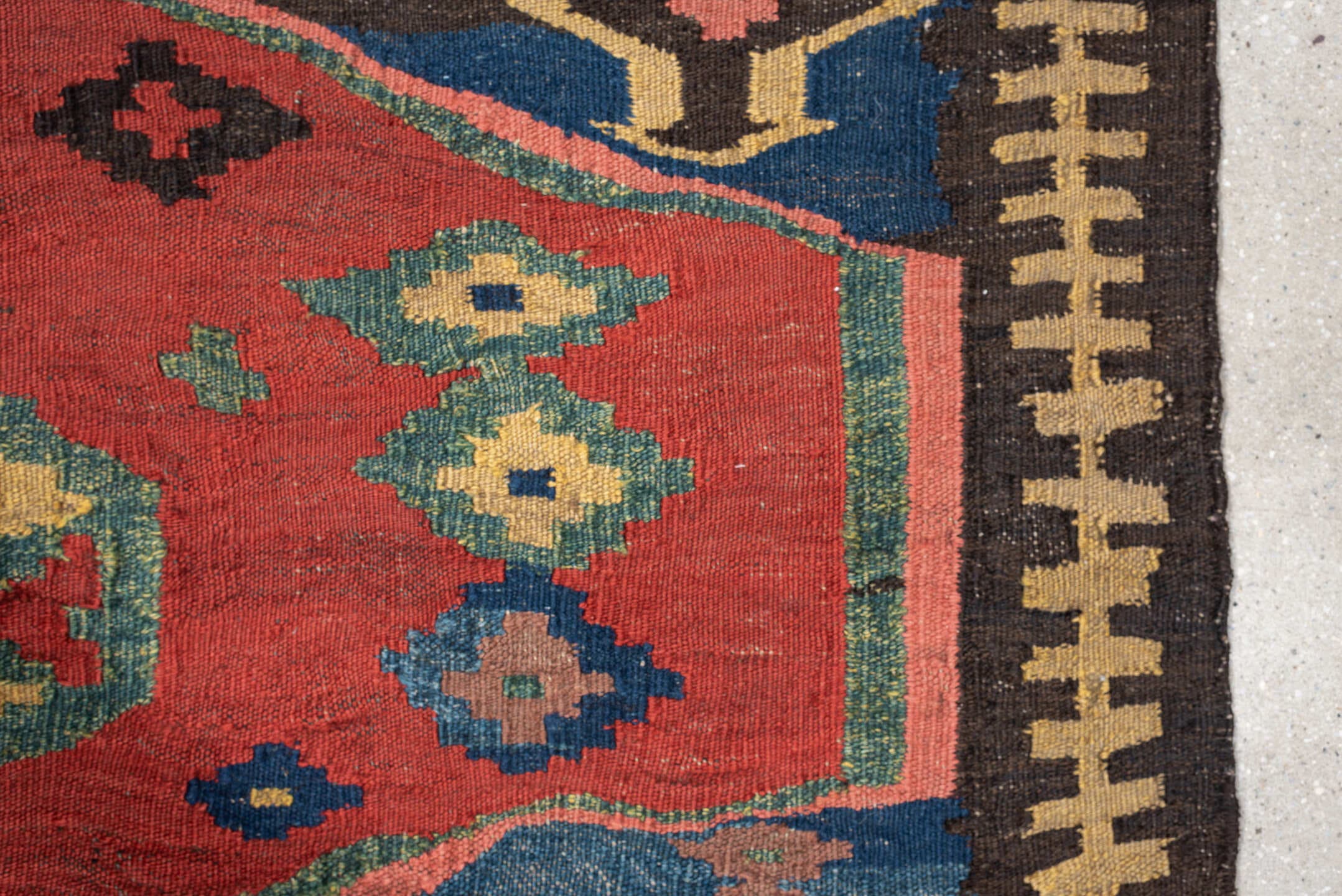 4' x 9' one-of-a-kind handmade antique Kilim medium size rug. Color palette: rust, blue, ivory, charcoal, rose, olive, teal