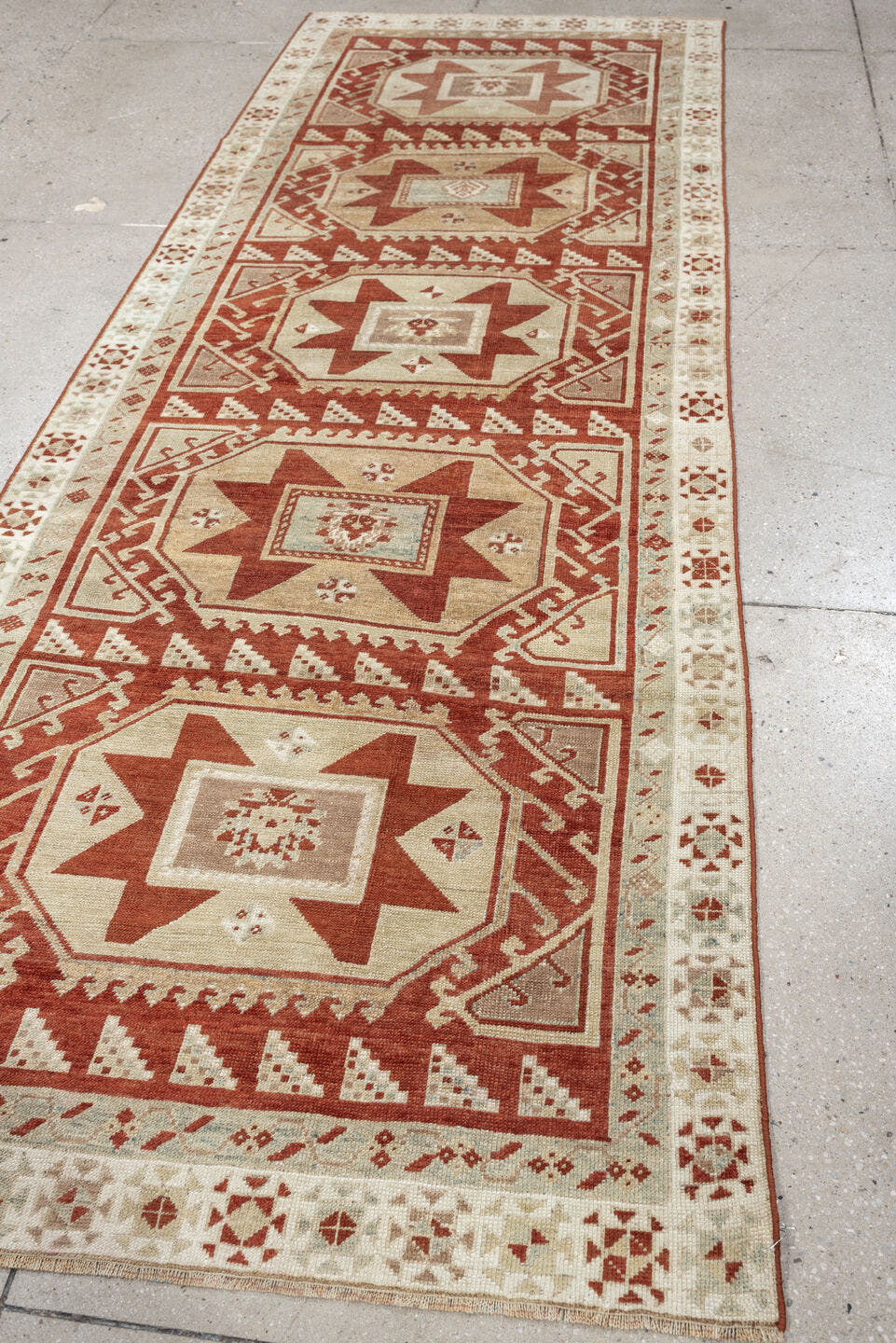 3' x 10' one-of-a-kind handmade vintage Caucasian runner rug. Color palette: ivory, terracotta, rust, blue gray, taupe