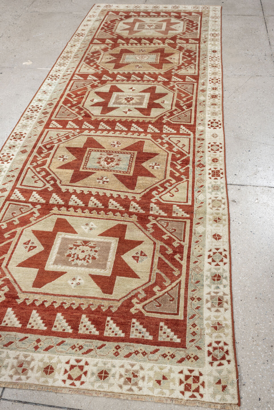 3' x 10' one-of-a-kind handmade vintage Caucasian runner rug. Color palette: ivory, terracotta, rust, blue gray, taupe