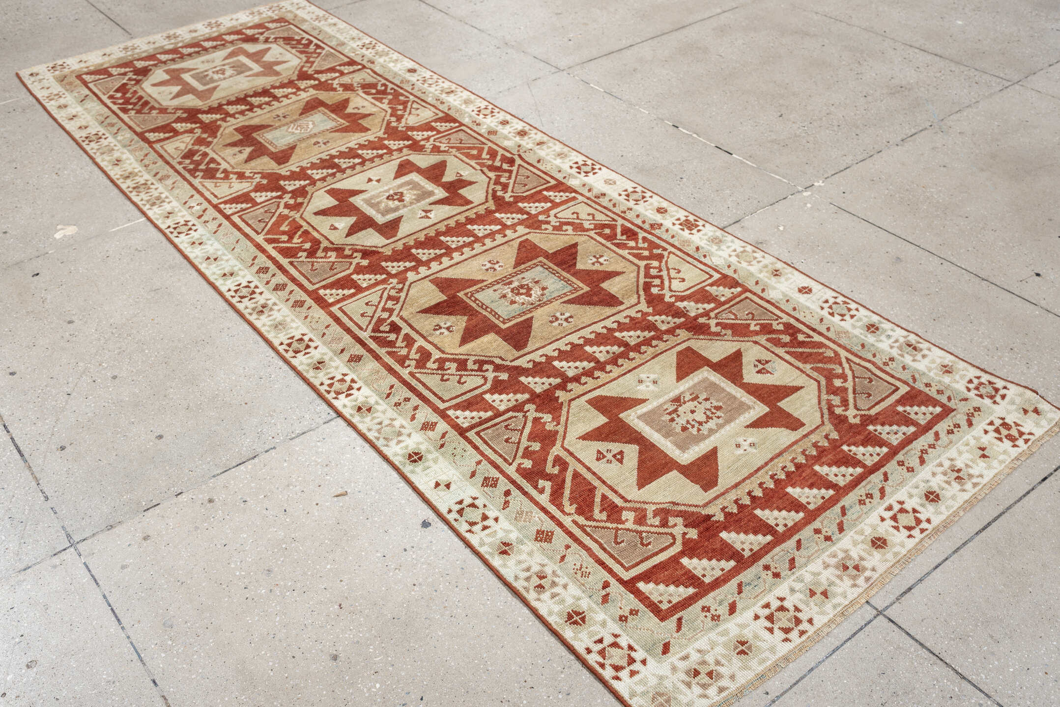 3' x 10' one-of-a-kind handmade vintage Caucasian runner rug. Color palette: ivory, terracotta, rust, blue gray, taupe