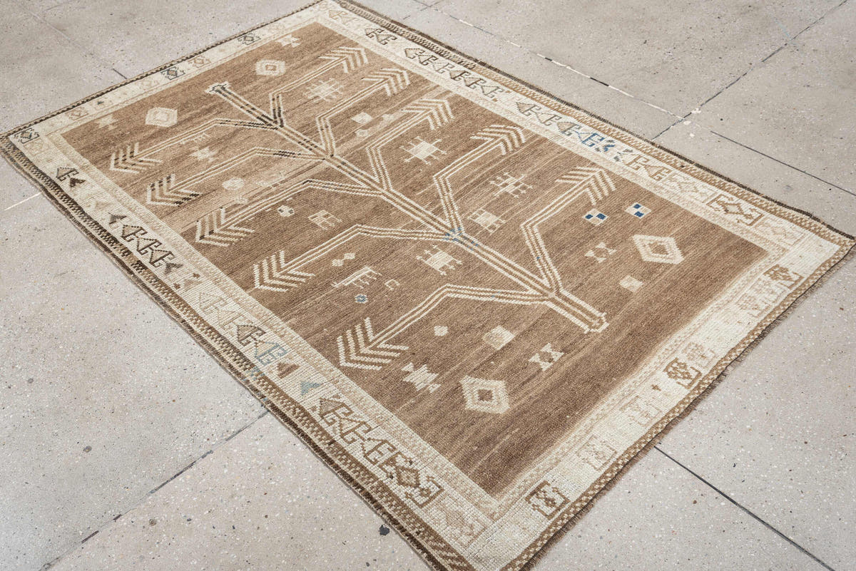 4' x 6' one-of-a-kind handmade antique Gabbeh small size rug. Color palette: camel, ivory, taupe, brown, charcoal, blue