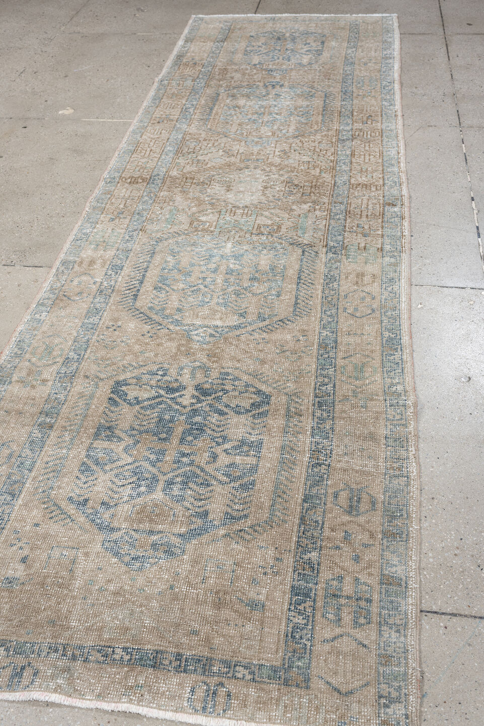 3' x 11' one-of-a-kind handmade antique Heriz runner rug. Color palette: ivory, pale blue, beige, taupe, camel, light blue