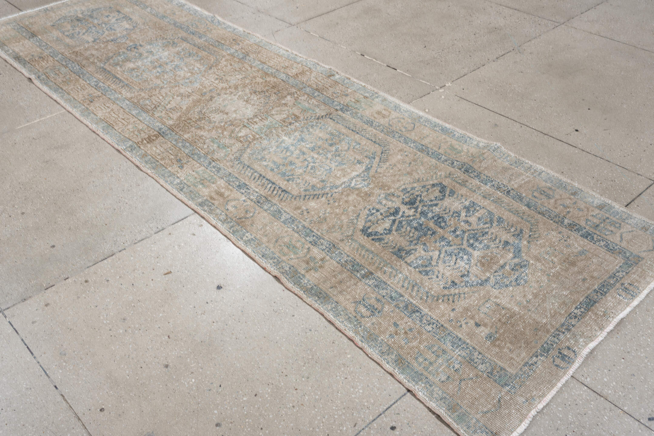 3' x 11' one-of-a-kind handmade antique Heriz runner rug. Color palette: ivory, pale blue, beige, taupe, camel, light blue