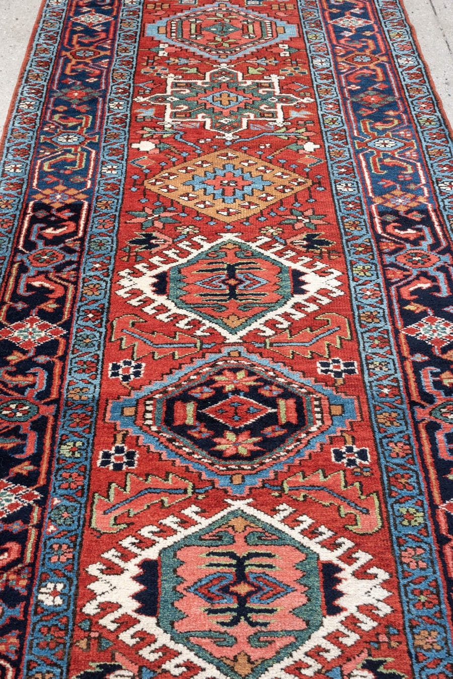 3' x 15' one-of-a-kind handmade antique Karaje runner rug. Color palette: rust, navy, teal, ivory, coral, light blue