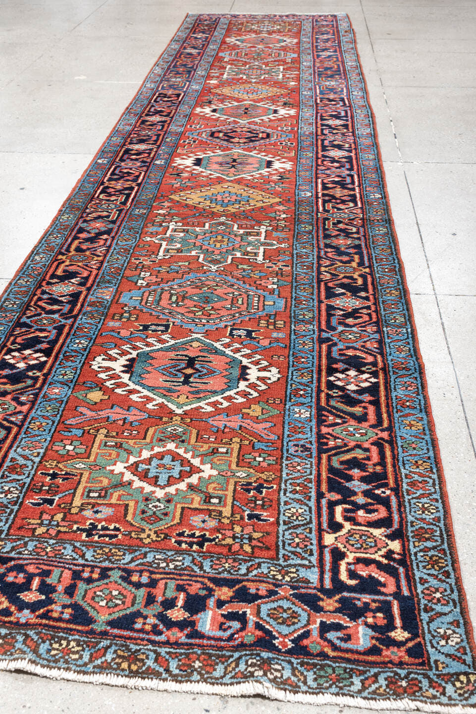 3' x 15' one-of-a-kind handmade antique Karaje runner rug. Color palette: rust, navy, teal, ivory, coral, light blue