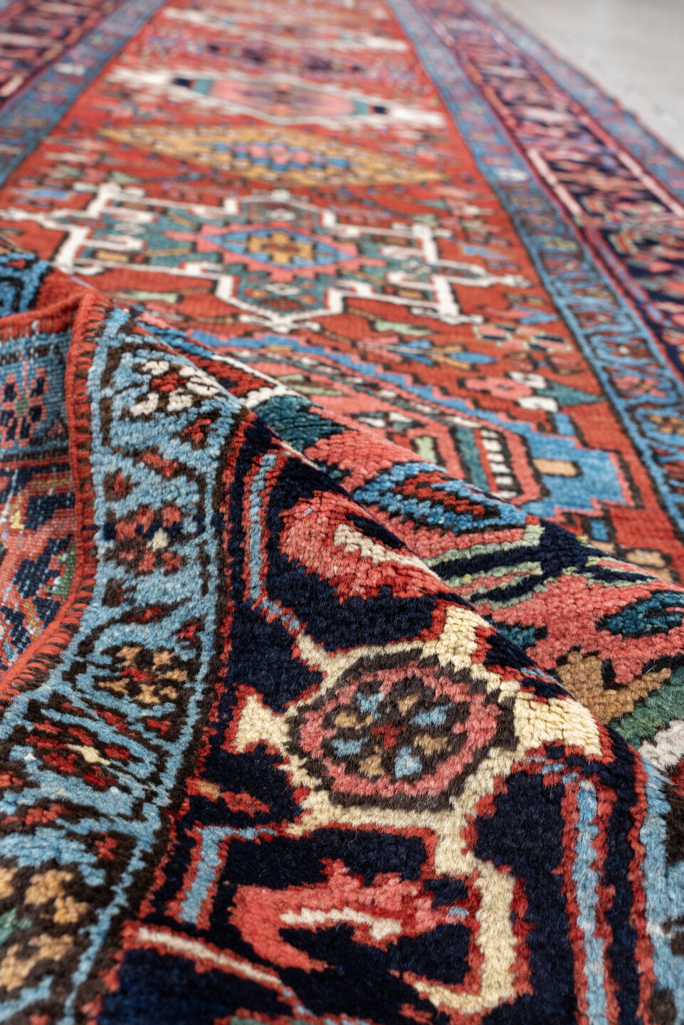 3' x 15' one-of-a-kind handmade antique Karaje runner rug. Color palette: rust, navy, teal, ivory, coral, light blue