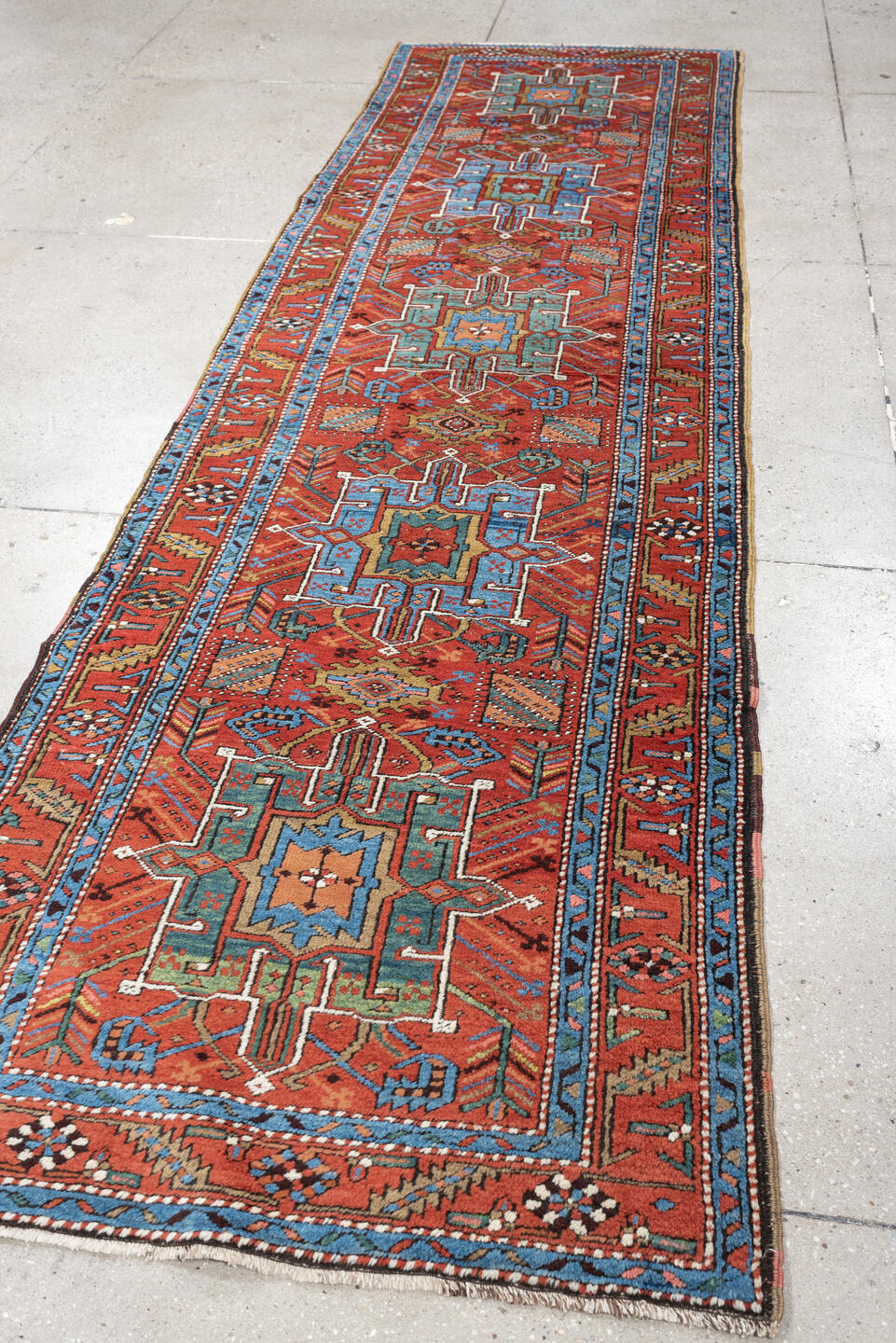 3' x 10' one-of-a-kind handmade antique Heriz runner rug. Color palette: rust, turquoise, sky blue, ivory, coral, navy, sage