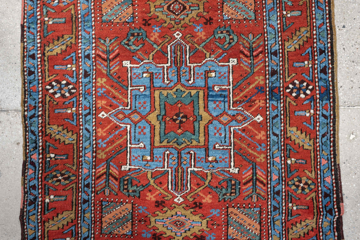 3' x 10' one-of-a-kind handmade antique Heriz runner rug. Color palette: rust, turquoise, sky blue, ivory, coral, navy, sage