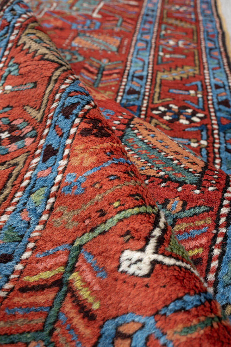 3' x 10' one-of-a-kind handmade antique Heriz runner rug. Color palette: rust, turquoise, sky blue, ivory, coral, navy, sage
