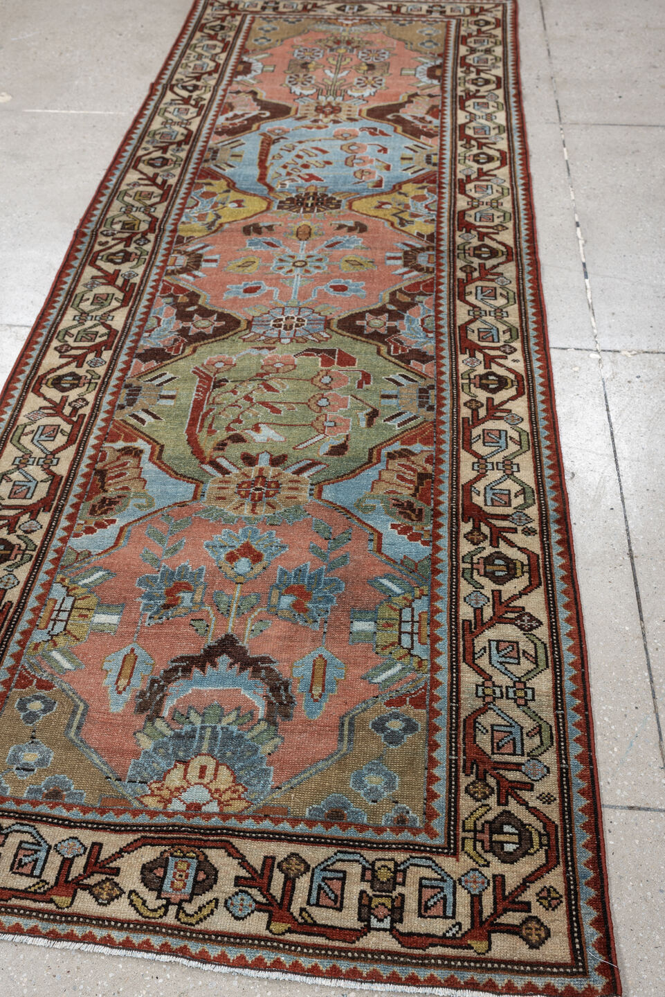 3' x 9' one-of-a-kind handmade antique Baktiary runner rug. Color palette: rose, ivory, pale blue, sage, rust, brown, taupe