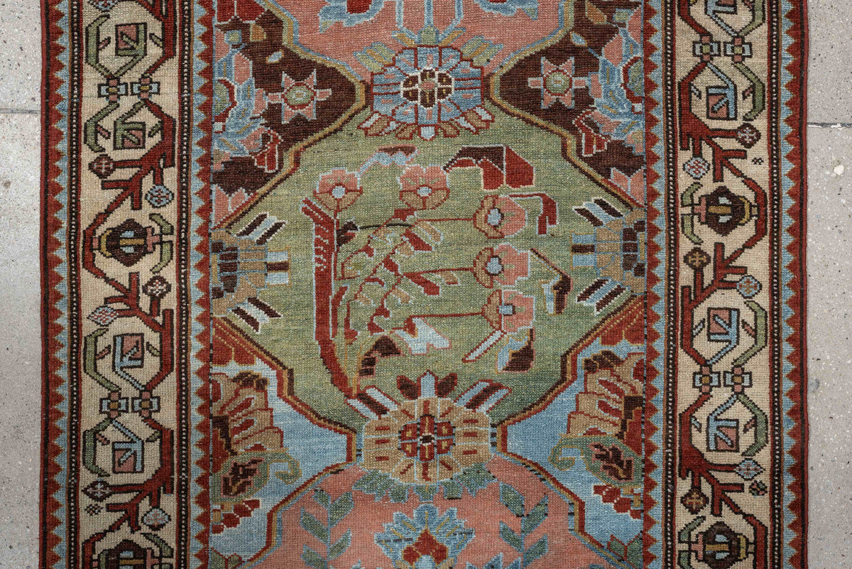 3' x 9' one-of-a-kind handmade antique Baktiary runner rug. Color palette: rose, ivory, pale blue, sage, rust, brown, taupe