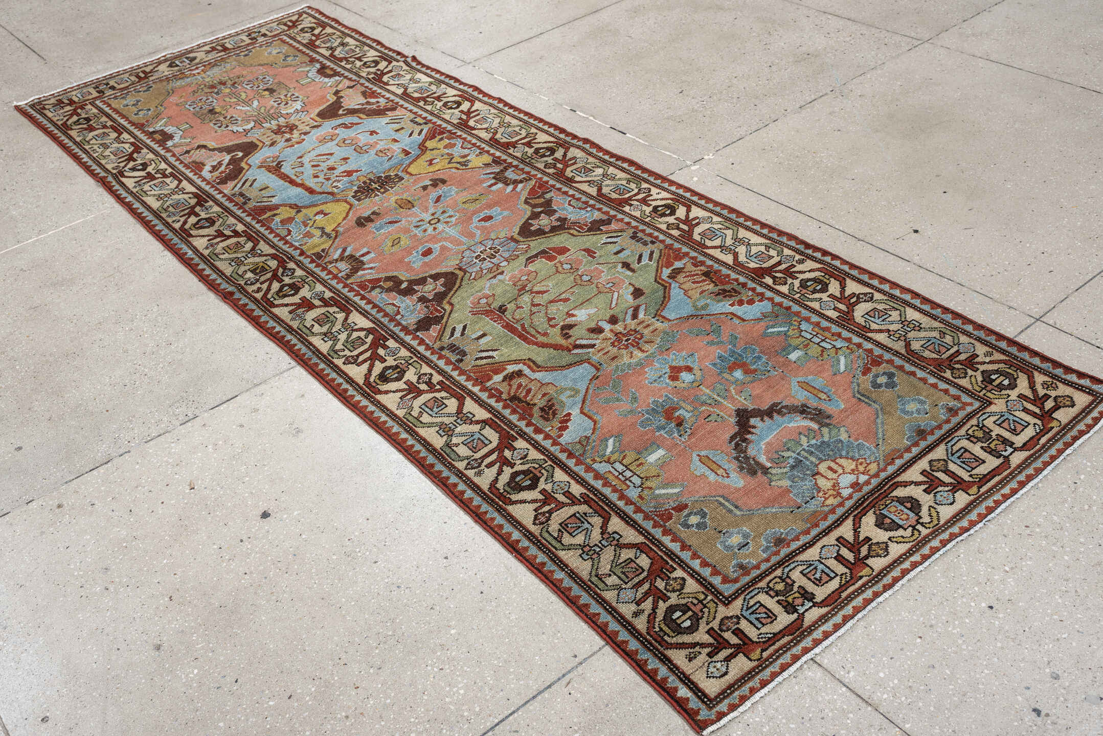 3' x 9' one-of-a-kind handmade antique Baktiary runner rug. Color palette: rose, ivory, pale blue, sage, rust, brown, taupe