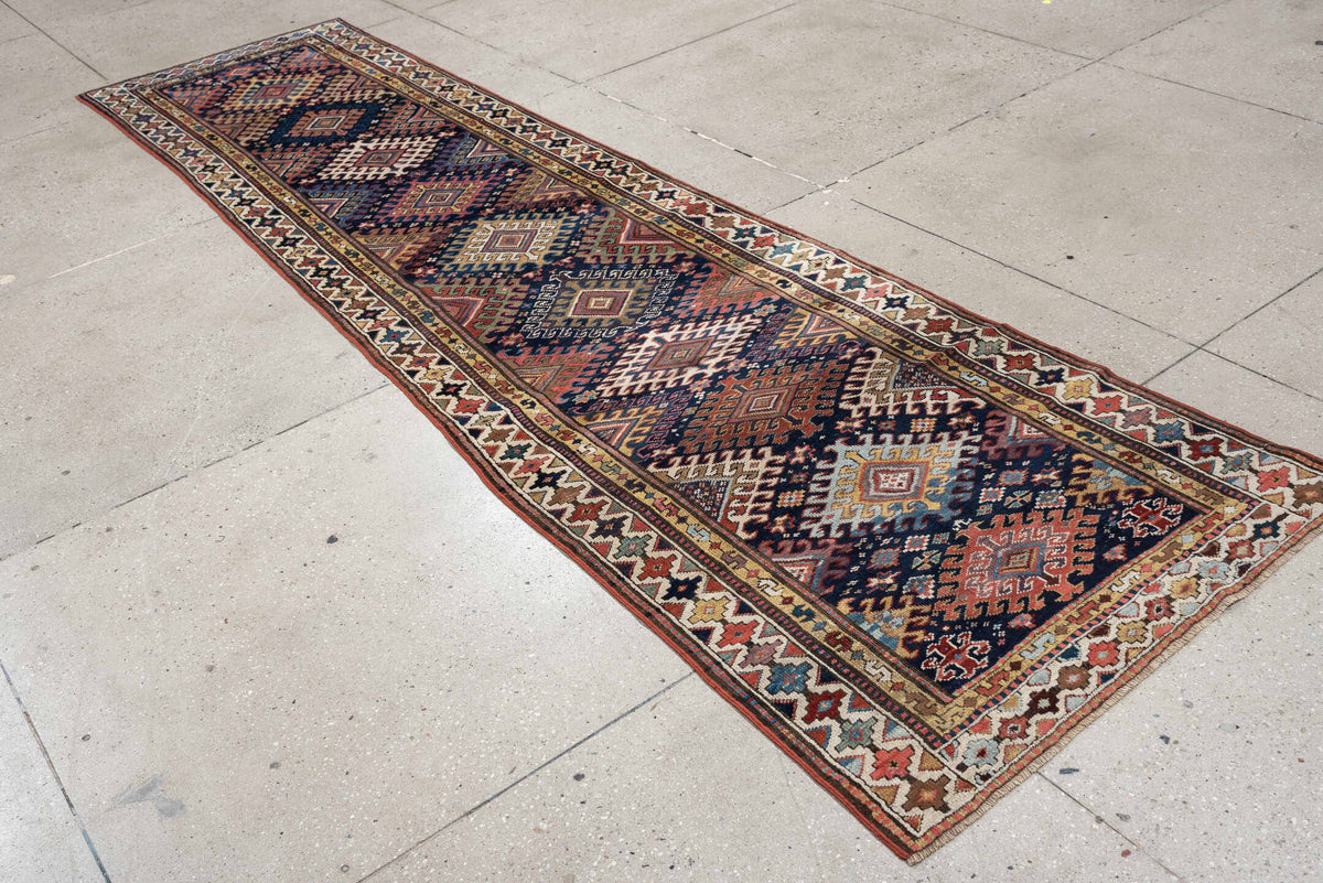 2' x 11' one-of-a-kind handmade antique NW Persian runner rug. Color palette: navy, ivory, rust, camel, terracotta
