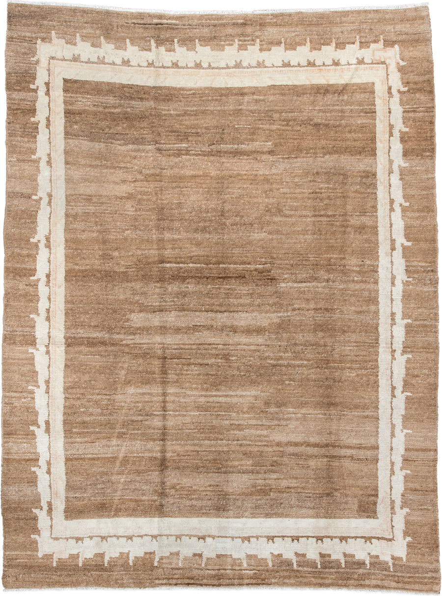 7' x 9' one-of-a-kind handmade vintage Tibetan rug. Color palette: camel, ivory, taupe, beige, cream, gray