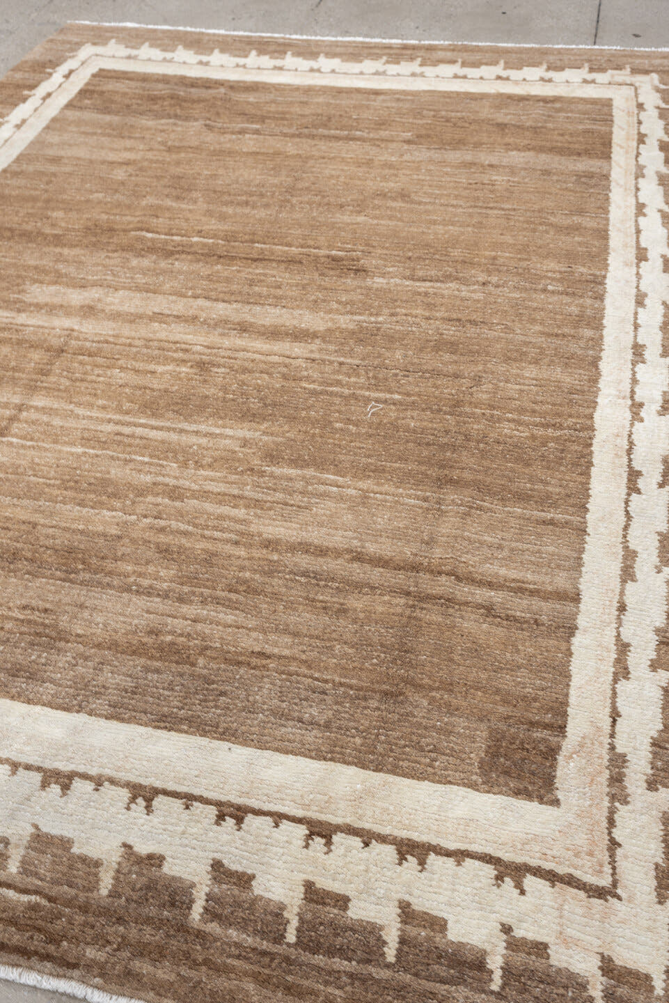 7' x 9' one-of-a-kind handmade vintage Tibetan rug. Color palette: camel, ivory, taupe, beige, cream, gray