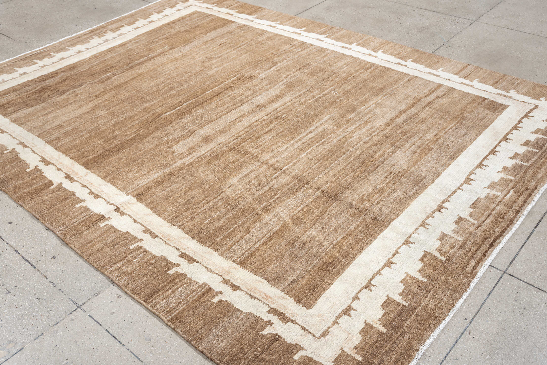 7' x 9' one-of-a-kind handmade vintage Tibetan rug. Color palette: camel, ivory, taupe, beige, cream, gray