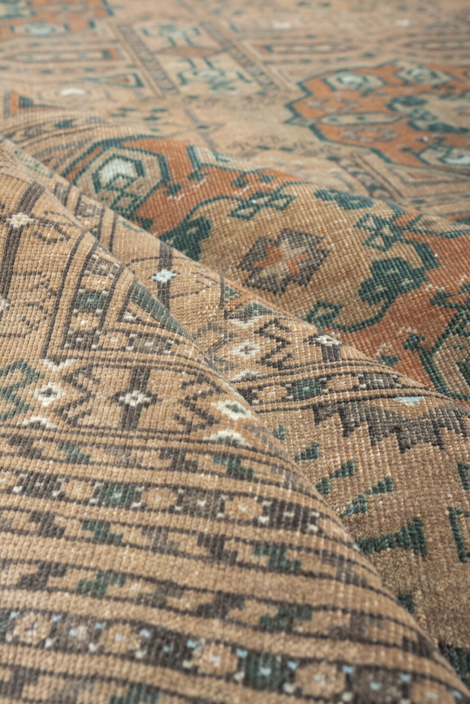 7' x 10' one-of-a-kind handmade antique Yamoud large size rug. Color palette: camel, taupe, terracotta, dusty teal, ivory
