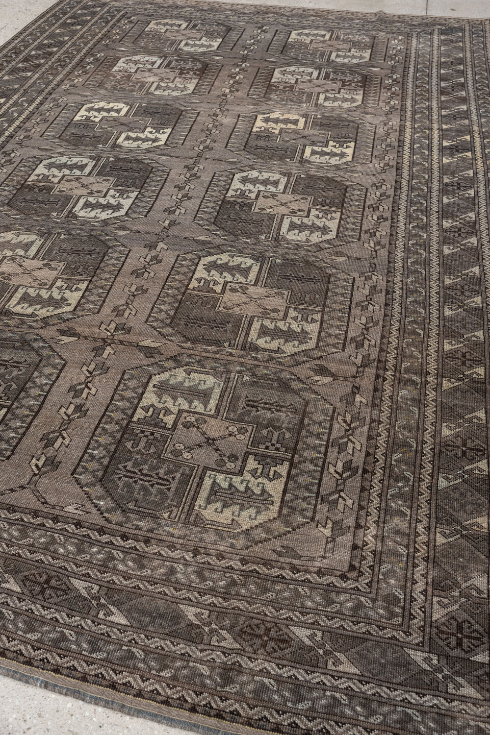 7' x 10' one-of-a-kind handmade antique Afghan large size rug. Color palette: taupe, brown, ivory, charcoal, slate, camel
