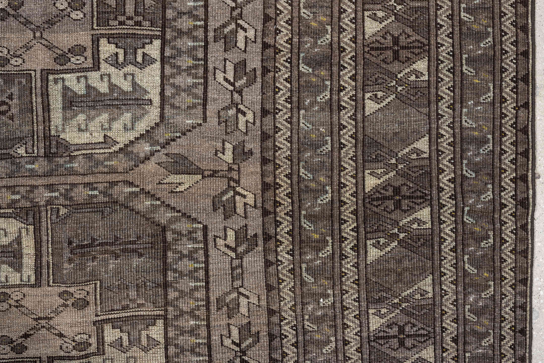 7' x 10' one-of-a-kind handmade antique Afghan large size rug. Color palette: taupe, brown, ivory, charcoal, slate, camel
