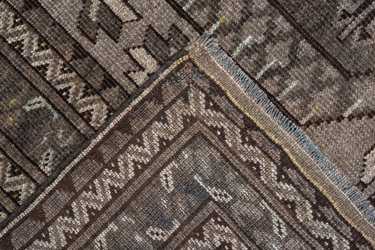 7' x 10' one-of-a-kind handmade antique Afghan large size rug. Color palette: taupe, brown, ivory, charcoal, slate, camel