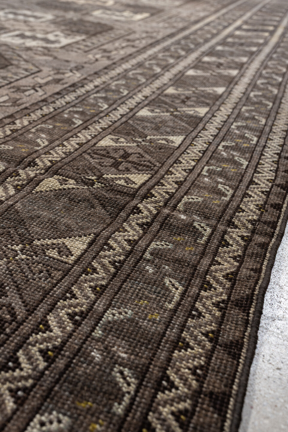 7' x 10' one-of-a-kind handmade antique Afghan large size rug. Color palette: taupe, brown, ivory, charcoal, slate, camel
